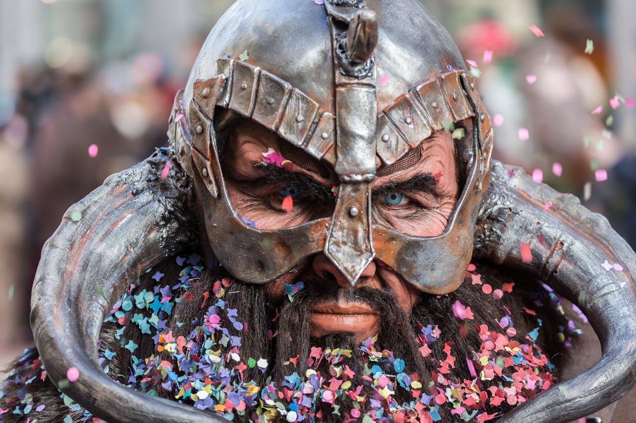 Close-up of a man in Viking cosplay with confetti during a Luzern carnival celebration.